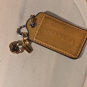 Coach Brown Leather Keychain with Gold Flower Charm